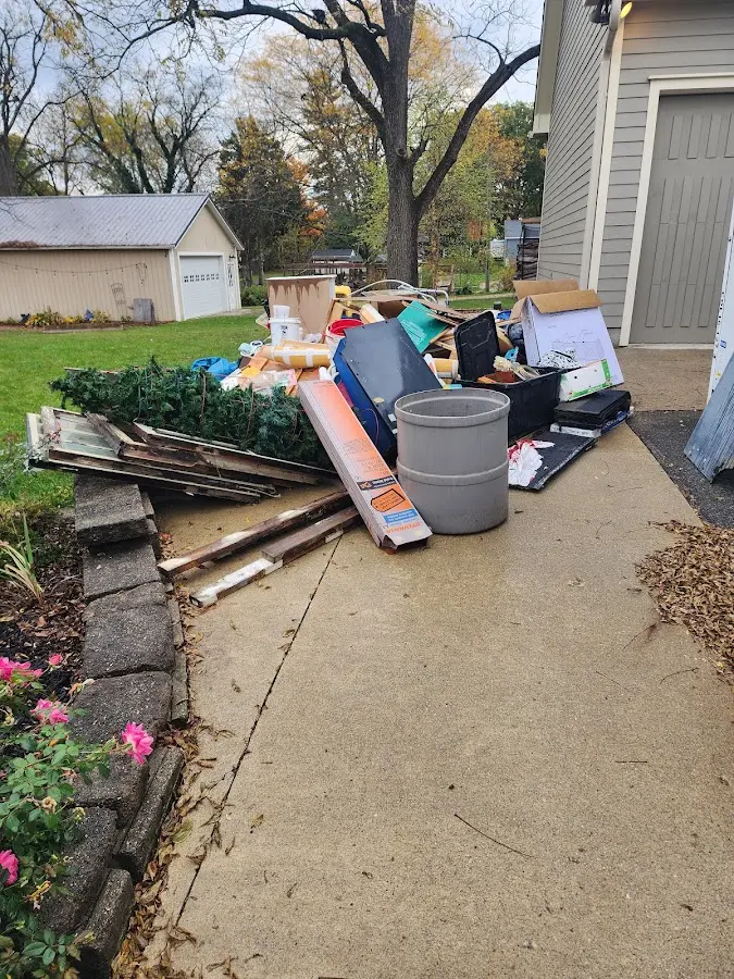 Dumpster being loaded with debris for Demolition Dumpster Rental in Taymouth